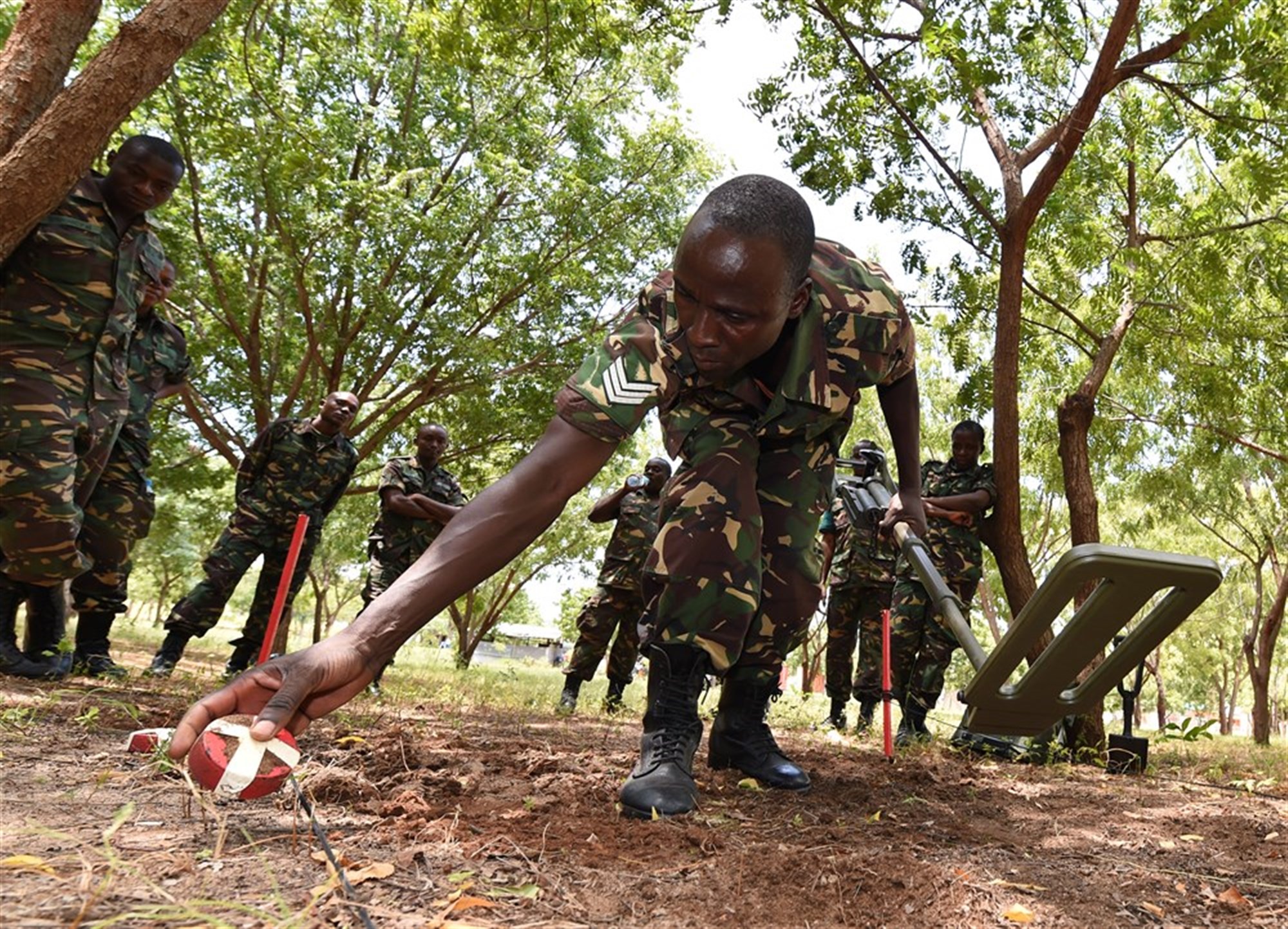 Sgt. Gaudence Siame, Tanzania People’s Defense Force ammunition technician, places a metal shape aside during a metal detector familiarization class at the Peace Keeping Training Center in Dar es Salaam, Tanzania Aug. 23, 2015. Two U.S. Navy Explosive Ordnance Disposal technicians, assigned to Combined to Joint Task Force- Horn of Africa, instructed a three-week Humanitarian Mine Action course to TPDF ammunition technicians and officers in order to increase ordnance knowledge.