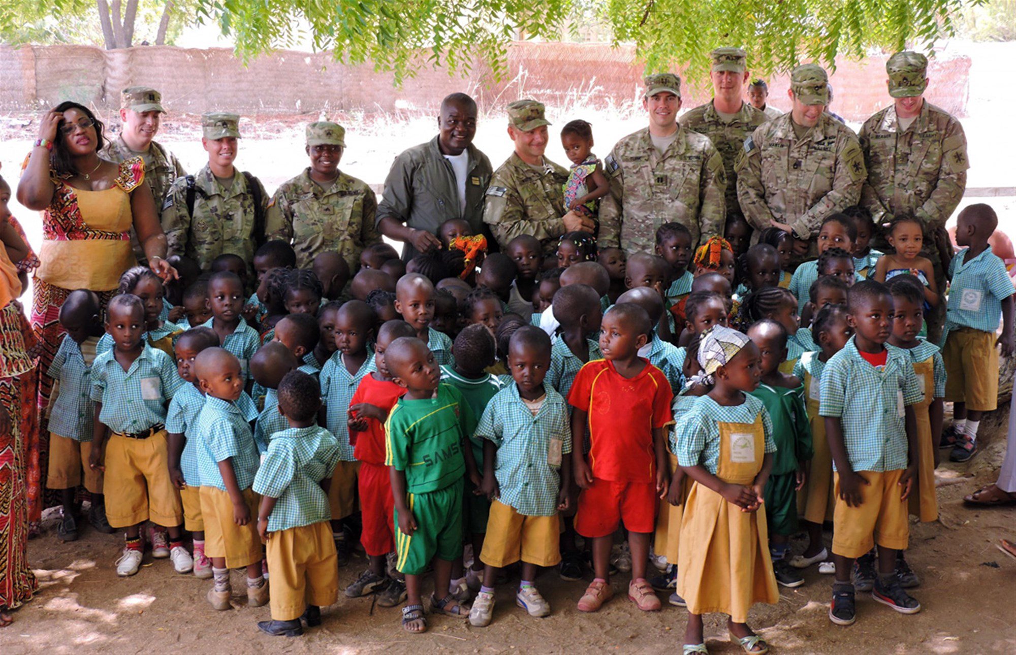 U.S. Soldiers present donated educational supplies to Cameroonian school children